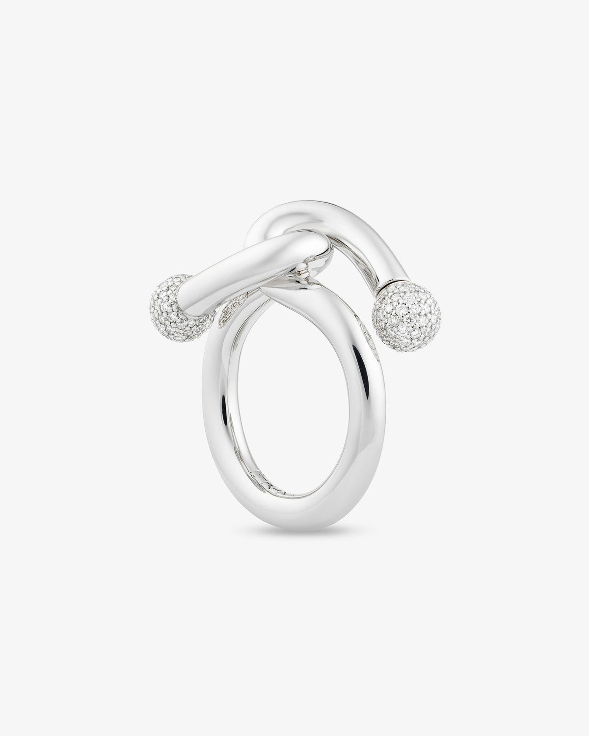 Falcat diamond ring in 18k white gold, set with natural diamonds.