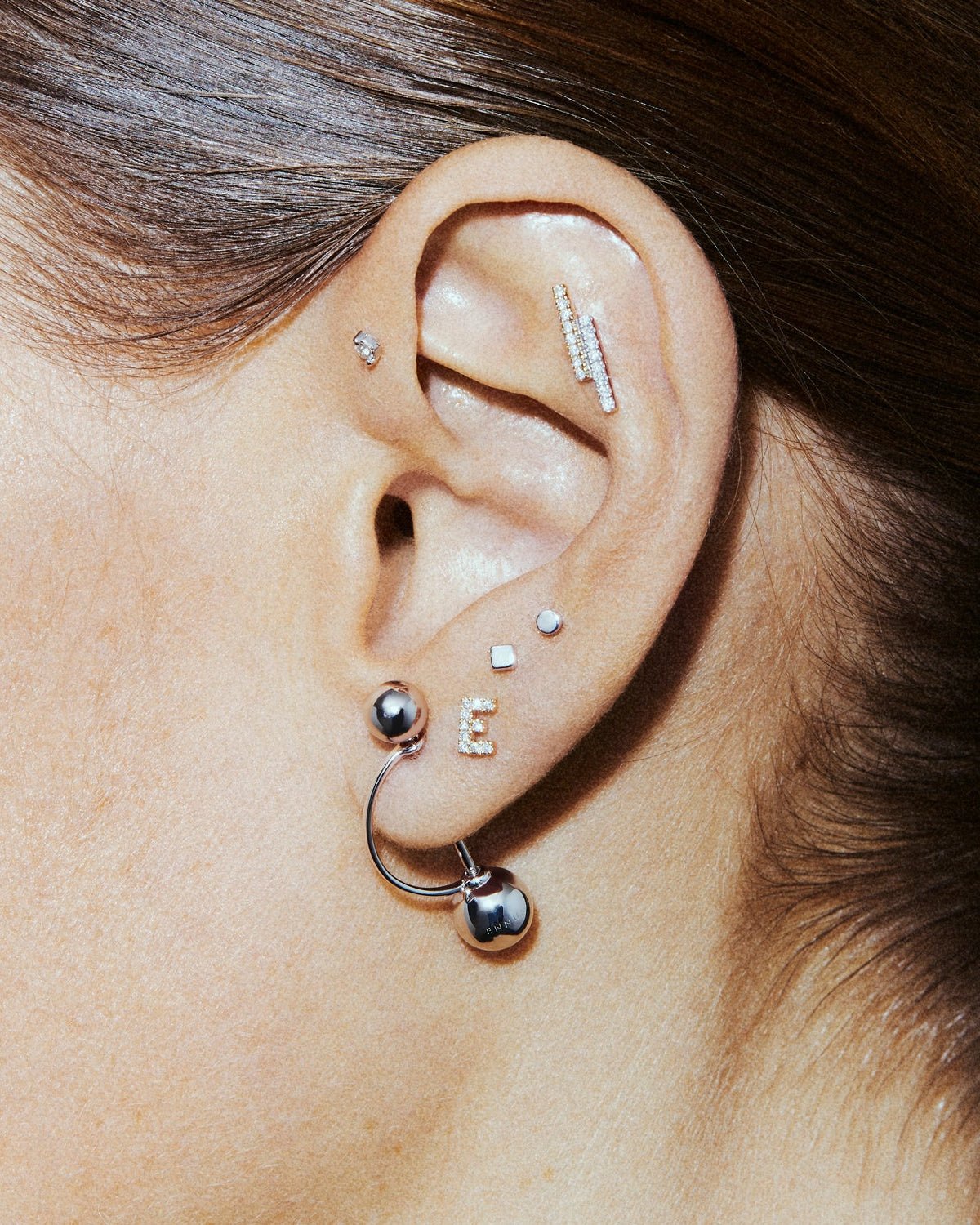 Square labret, shown worn.