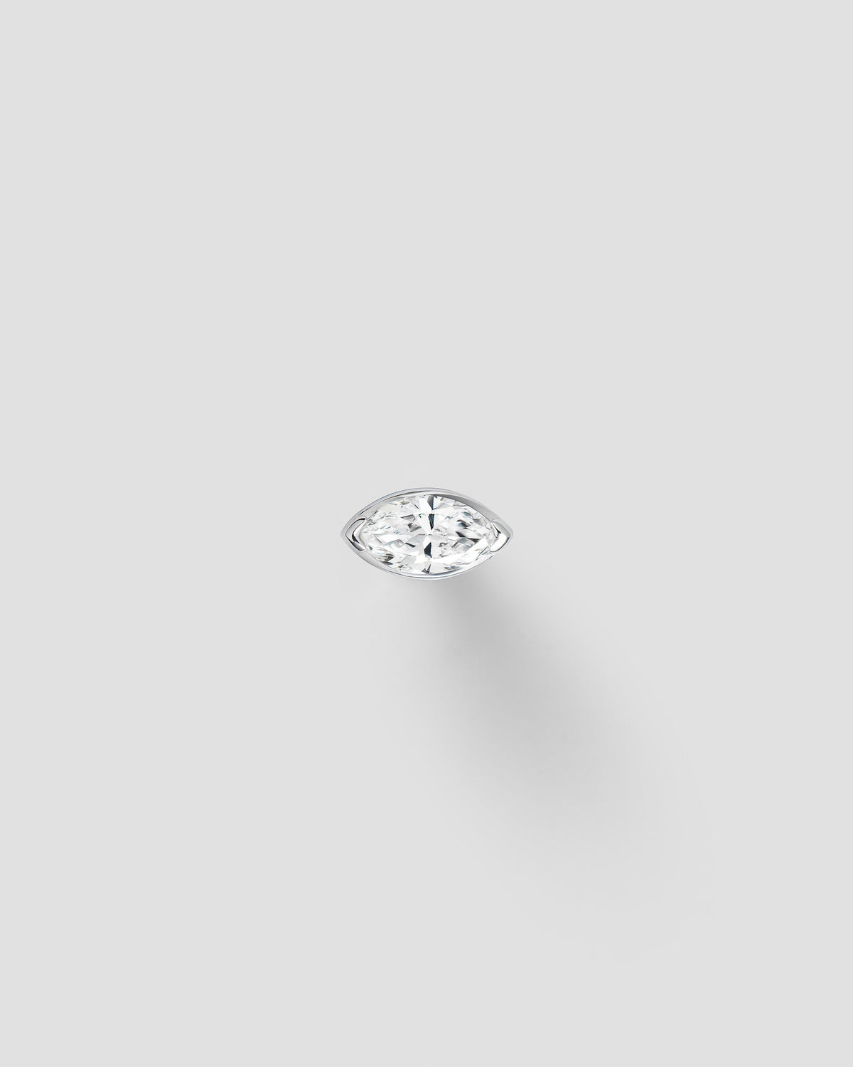 Andromis dot labret in 14k white gold, set with a natural diamond.