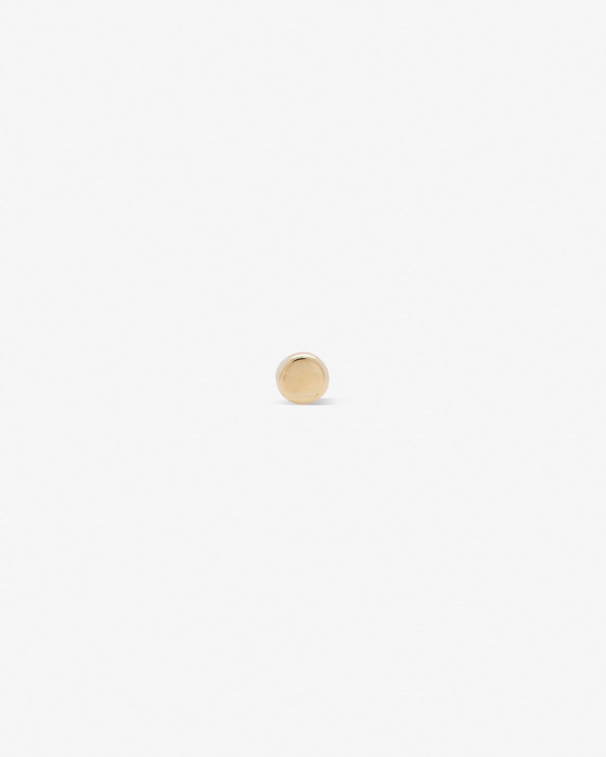 Full moon labret in 14k yellow gold.