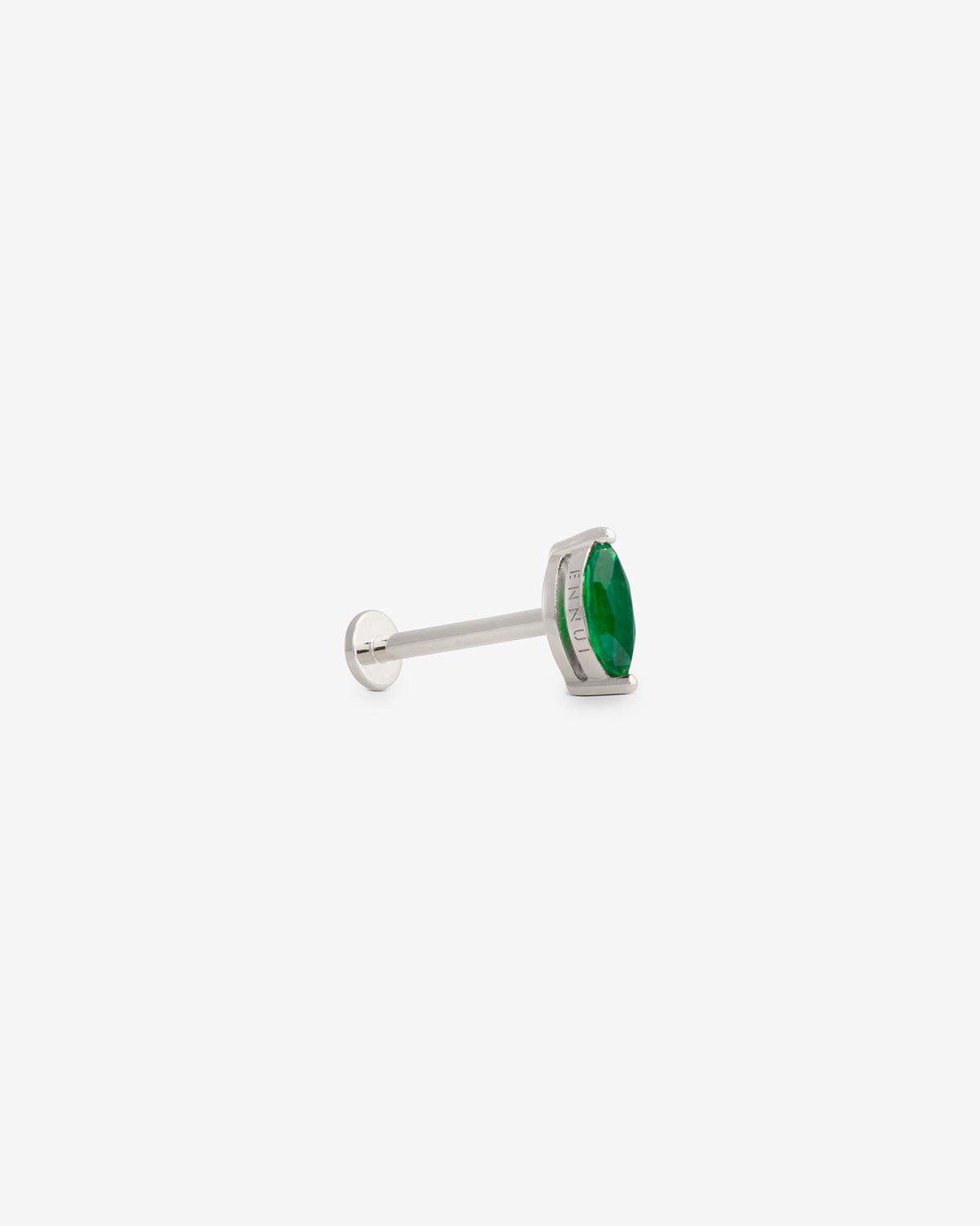 Awareness labret in 14k white gold, set with an emerald, detail view.