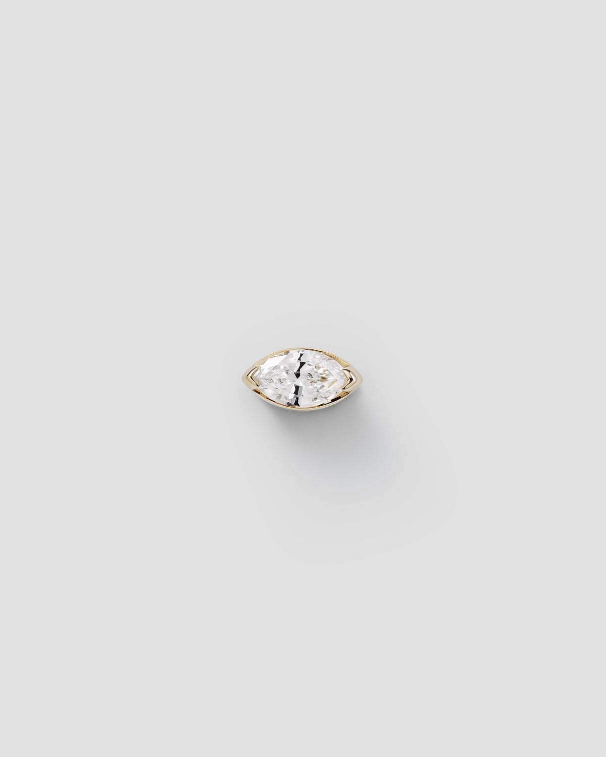 Andromis dot symbol charm in 14k yellow gold, set with a lab-grown white diamond.
