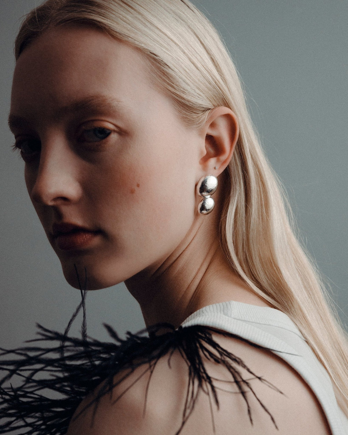 Plane earrings, detail view.