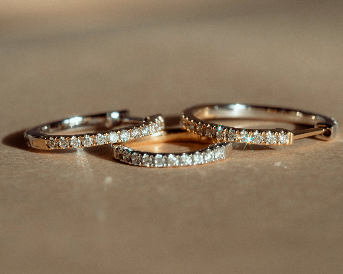 ENNUI Atelier jewelry in gold, photographed close up.