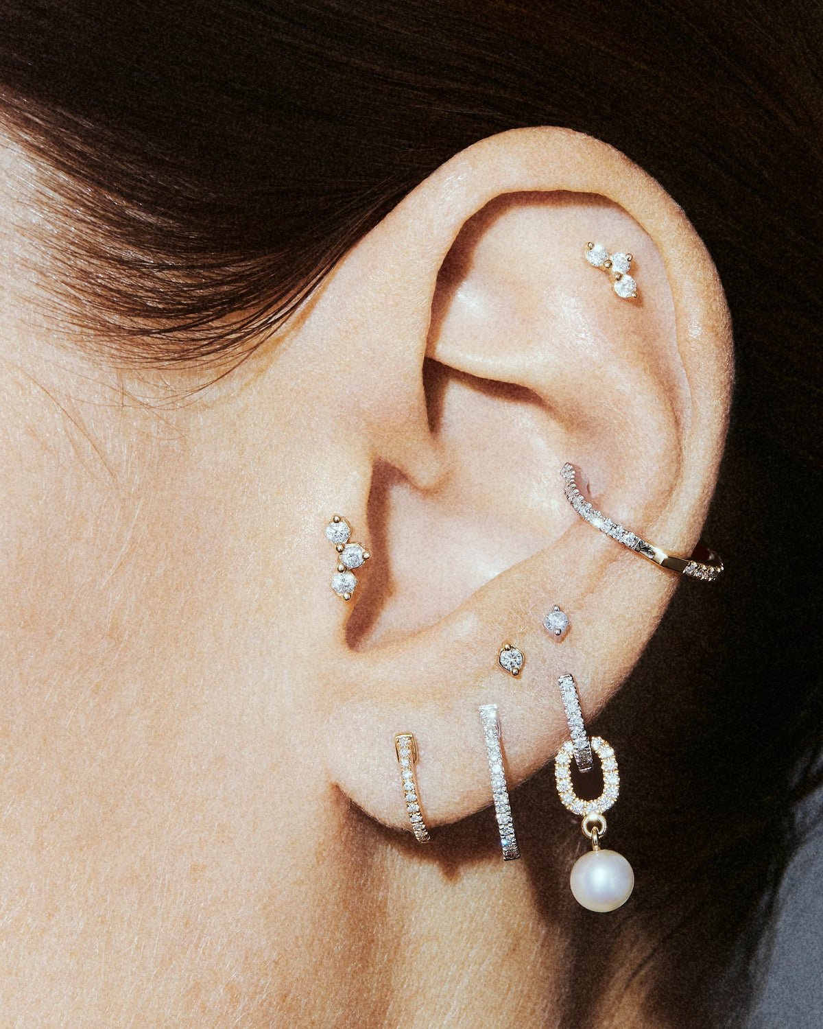 Honey I'm home labret in 14k white gold, set with natural diamonds, shown on the ear.