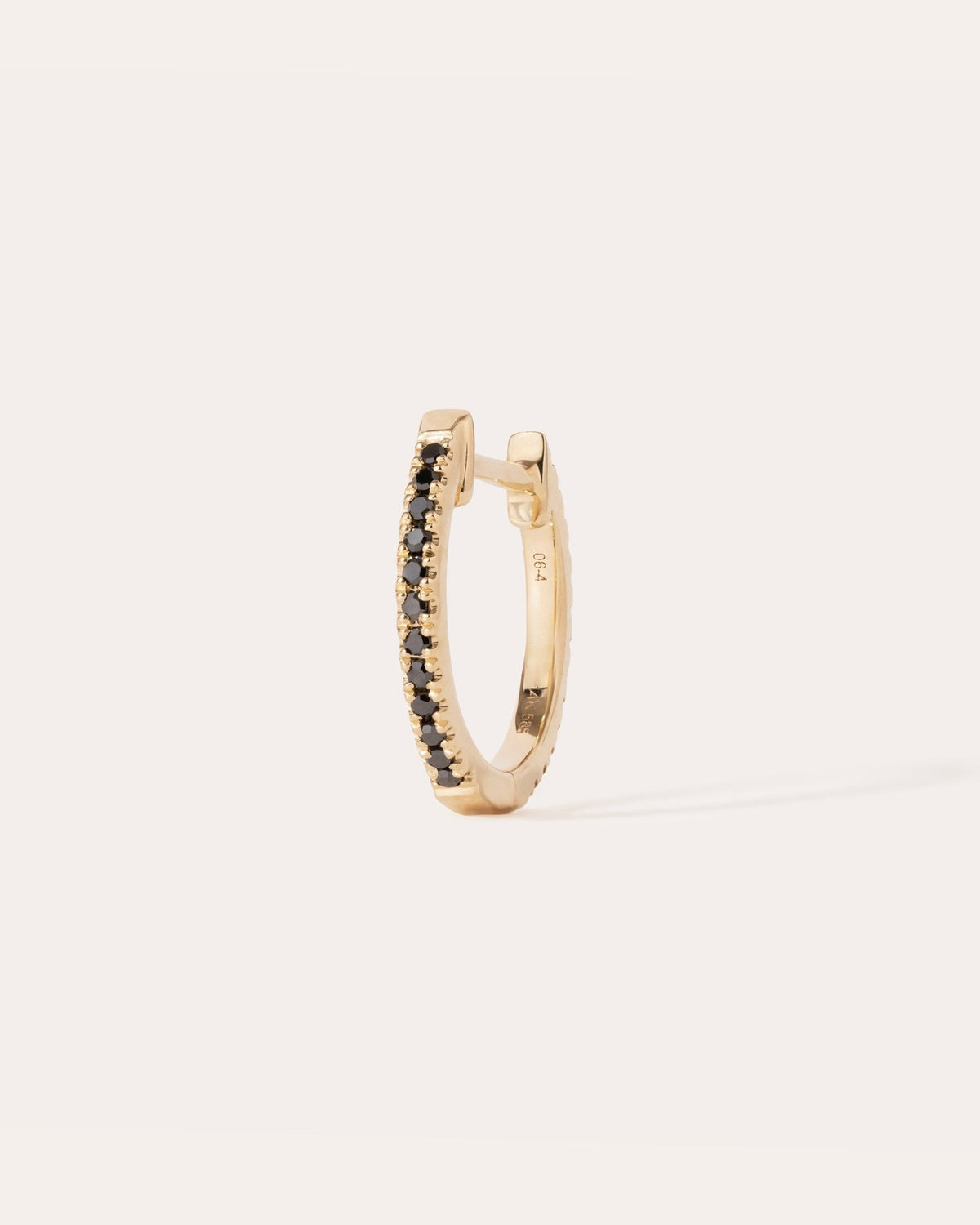 Eclipse hoop in 14k yellow gold, detail view.