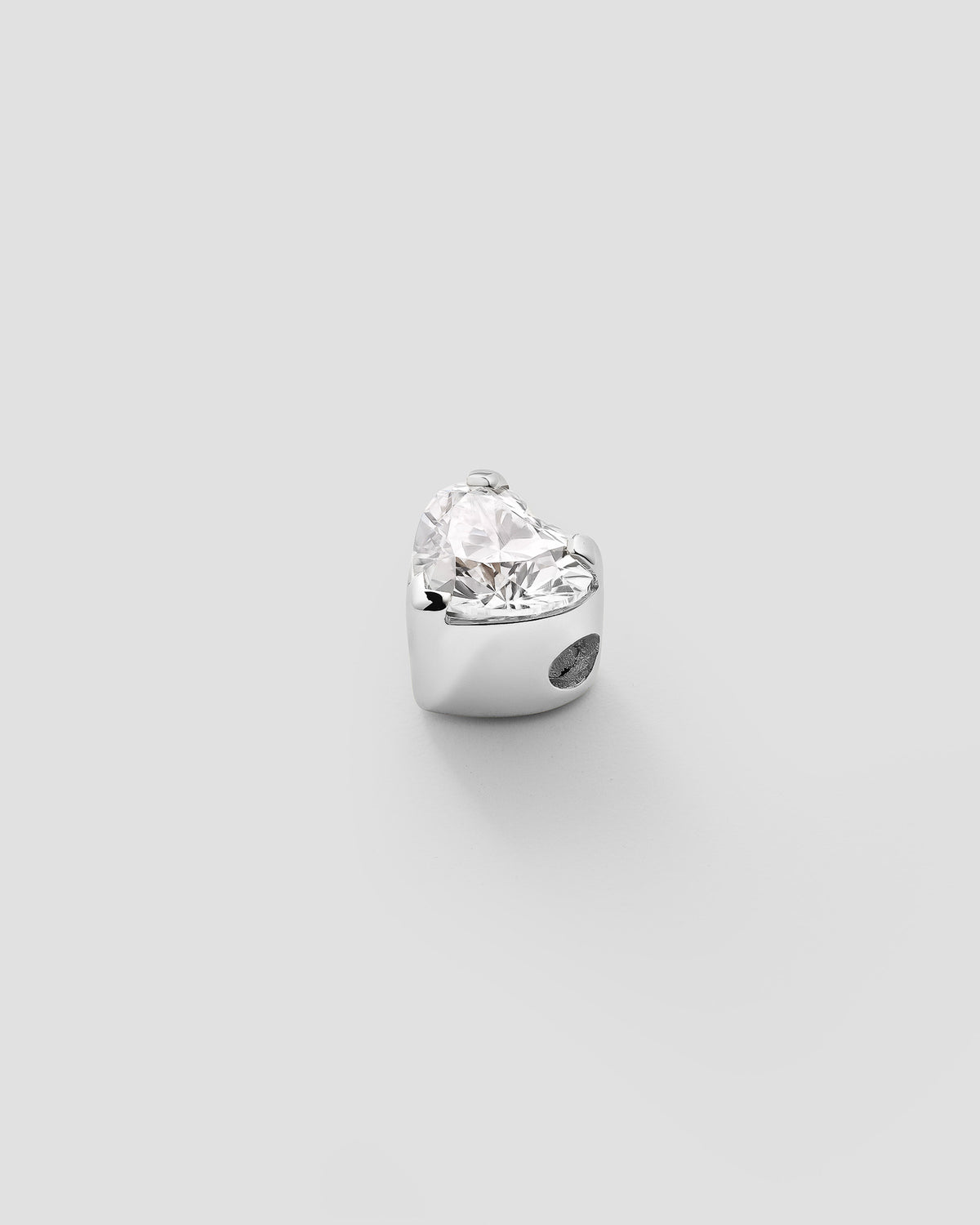 Erosia heart charm in 14k white gold, set with a lab grown diamond.