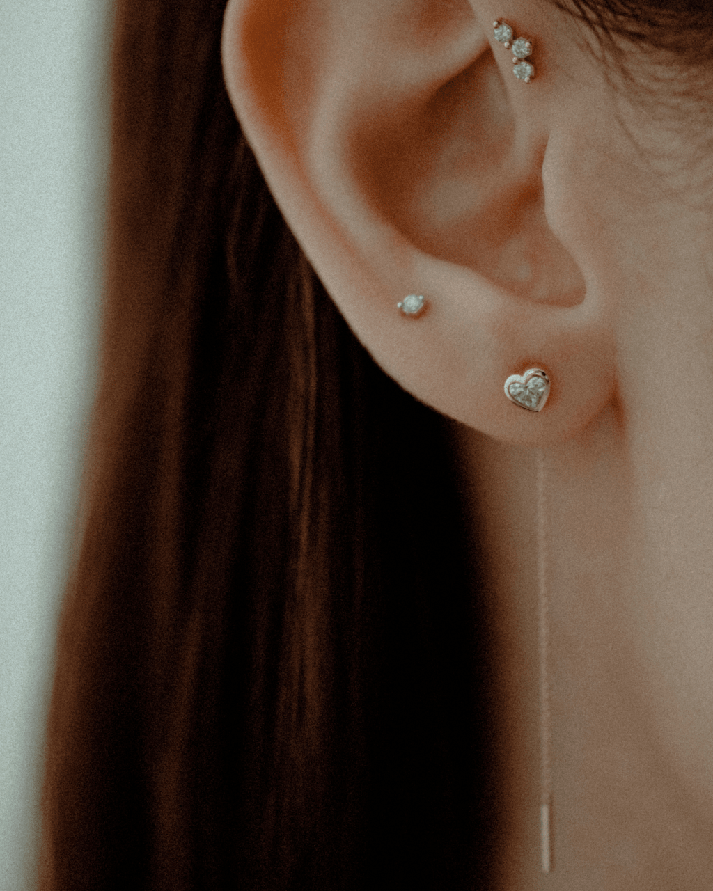Erosia heart in 14k yellow gold, set with a natural diamond, detail view.
