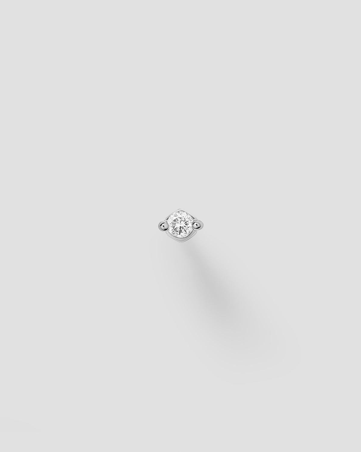 Ivory labret in 14k white gold.