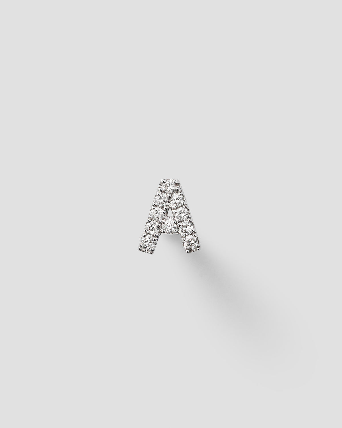 Letter labret in 14k white gold.