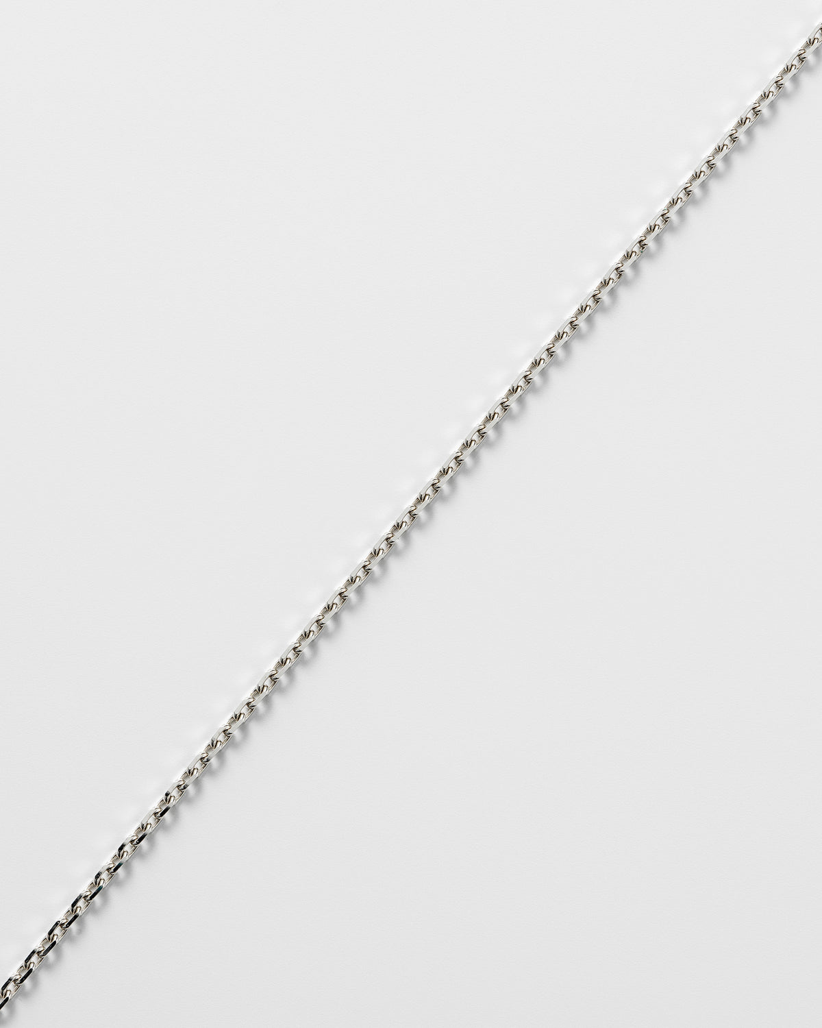 Anchor facet anklet in 925 silver, shown worn.