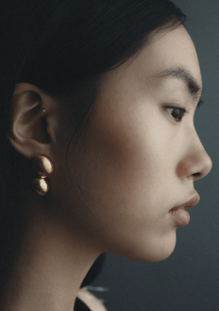 Plane earrings, shown worn.