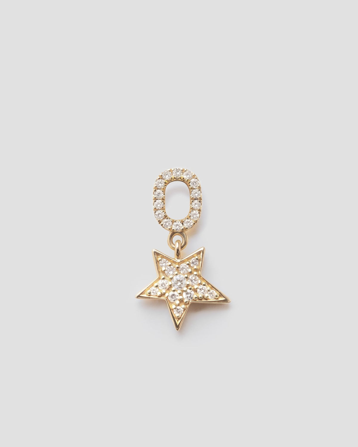 Celeste star pendant in 14k yellow gold, set with a natural diamond.