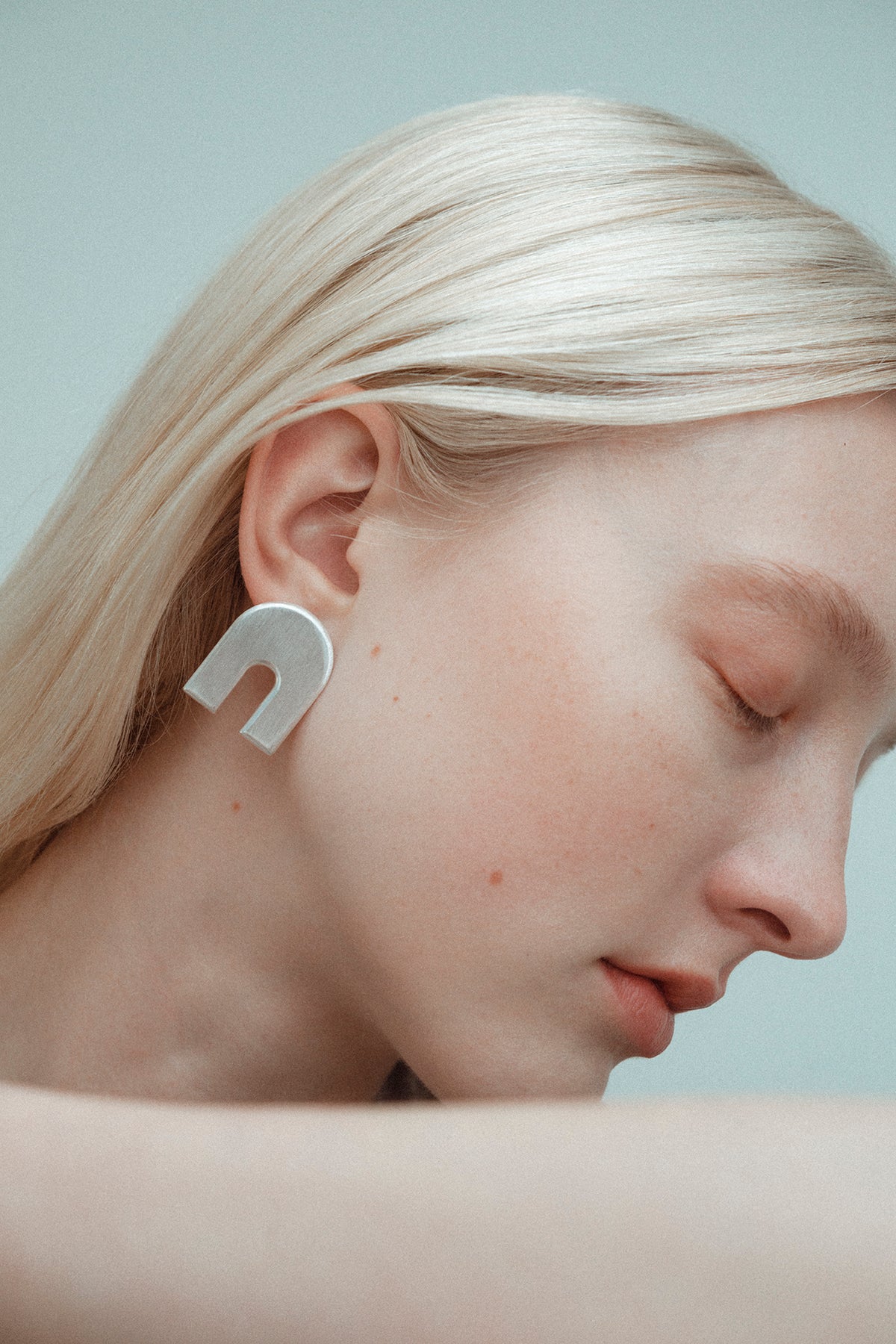 Iris Arch studs, shown worn.