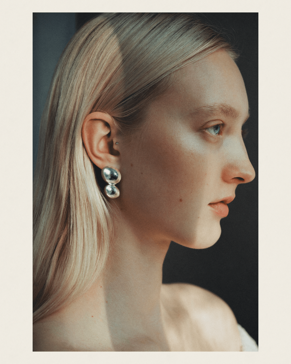Plane earrings, shown worn.