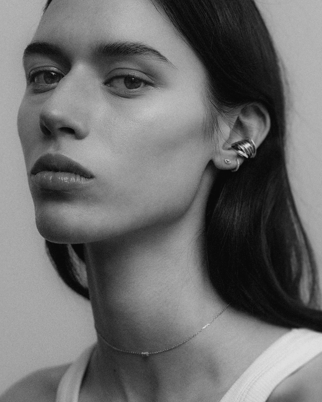 Themis earcuff, Eirene eye labret and linked necklace, shown worn.