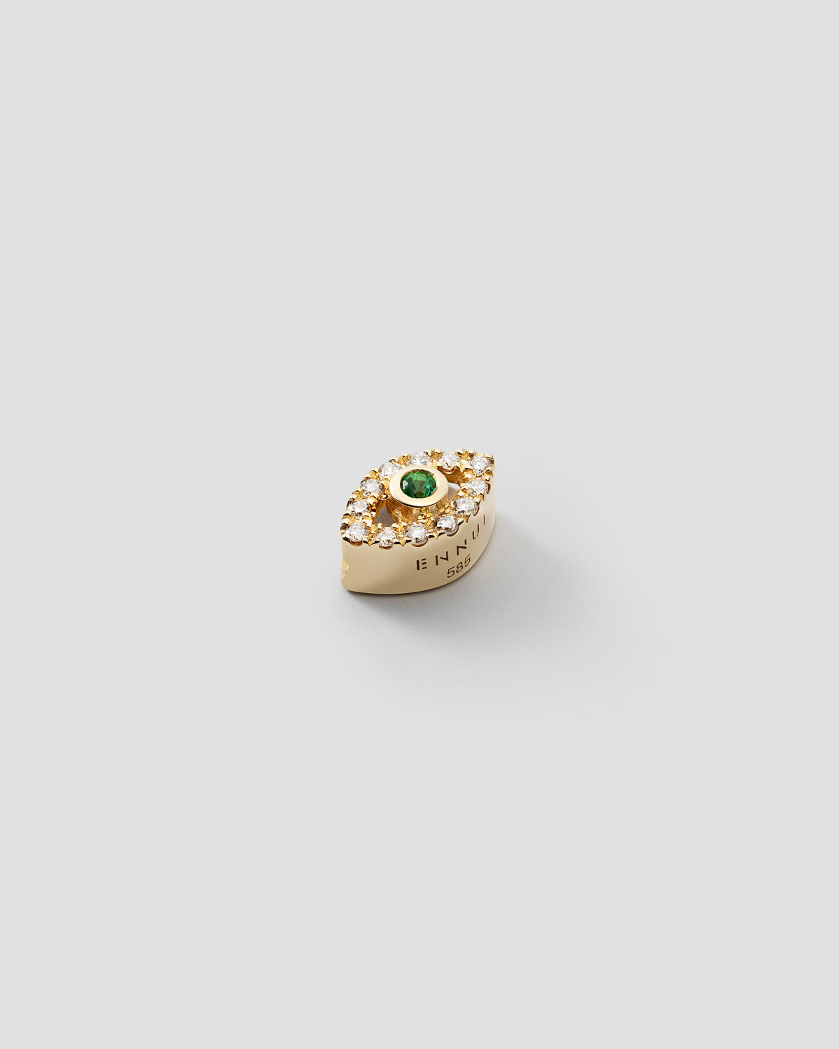 Eirene Eye charm in 14k yellow gold, set with an emerald and lab grown diamonds, detail view.