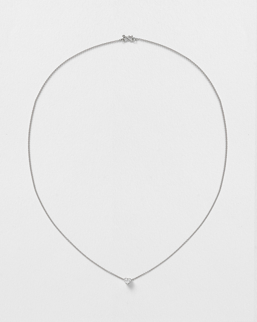 Erosia necklace with a 14k white gold charm on an 18k white gold chain.