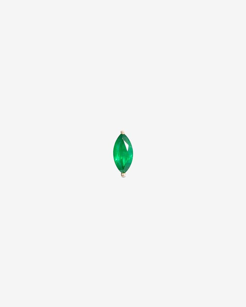Awareness labret in 14k yellow gold, set with an emerald.