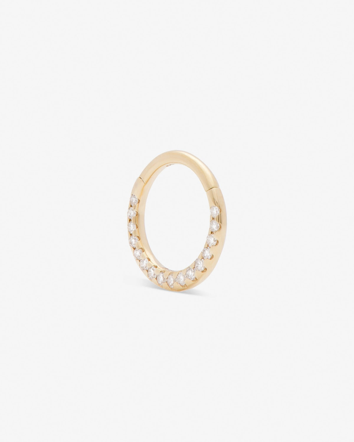 Diamond clicker in 14k yellow gold, set with a natural diamond, detail view.