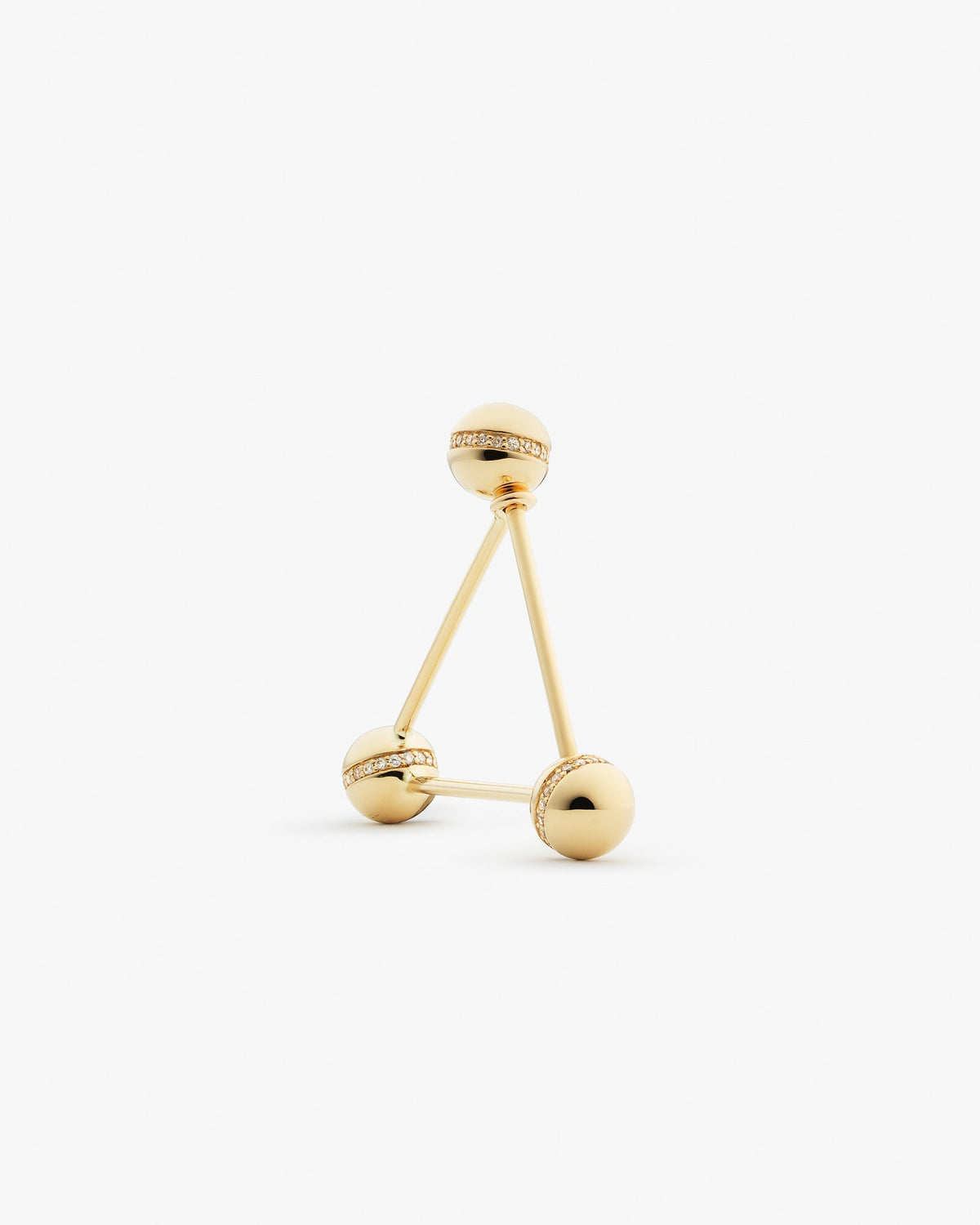 Triangle ear pin in 14k yellow gold, detail view.